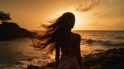 a stunning woman with flowing hair walking along a secluded tropical beach at sunset