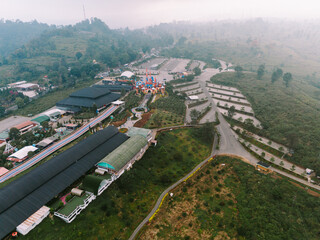 A tourist destination resembling a Disneyland-style castle located in a mountainous area of Bandung, offering picturesque views and a magical atmosphere for visitors