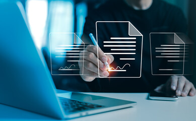 A businessman uses his laptop to sign documents related to transactions. notion of an electronic document, form agreement, smart contract, or bank over the internet using digital technologies