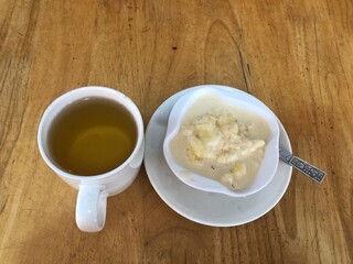 Fresh Cream in a White Bowl on Wooden Tabletop