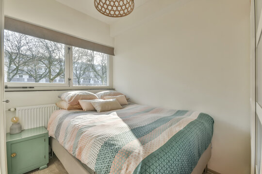 Modern bedroom with natural light and cozy decor