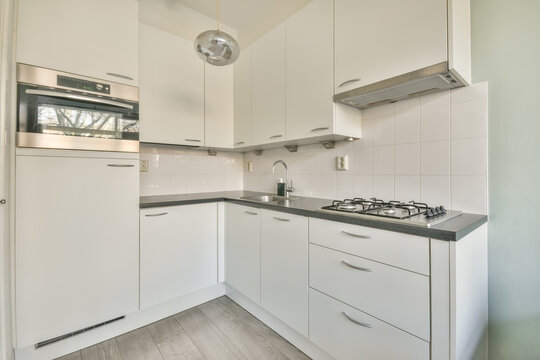 Modern kitchen interior with sleek white cabinets