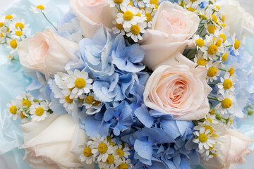 closeup of rose, hydrangea and daisy  bouquet