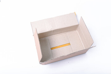 Closeup blank delivery box or cardboard box open isolated on white background. Paper box