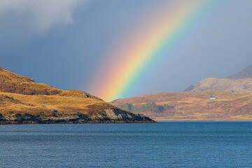 A brilliant rainbow stretching across the sky after a light afternoon shower 