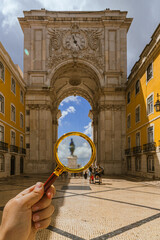 Rua augusta arc through a magnifying glass