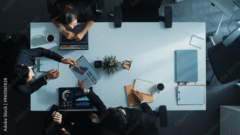 Aufkleber top down aerial view of smart manager pointing at financial graph on whiteboard while diverse busine