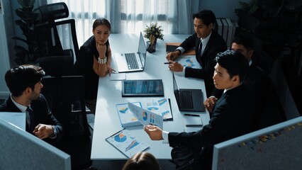 Top view of diverse business people brainstorm marketing idea while marketing team analyst stock market investment. Group of skilled project manager solving problems and sharing plan. Directorate.