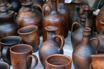 handmade earthenware pots and jug close-up, traditional tableware production