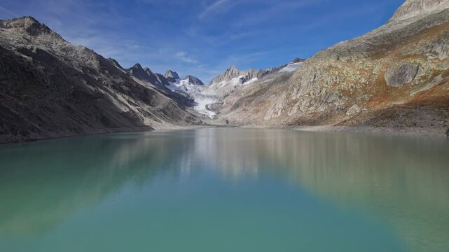 Aerial view of Oberaar lake (Oberaarsee) and Upper Aare Glacier (Oberaargletscher), Switzerland. 2x speeded up from 30 fps.