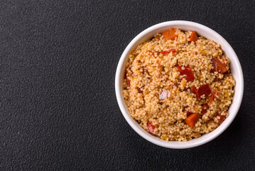Delicious hot boiled wheat porridge couscous with vegetables