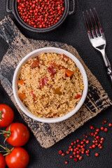 Delicious hot boiled wheat porridge couscous with vegetables