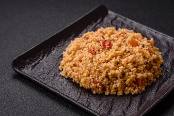 Delicious hot boiled wheat porridge couscous with vegetables