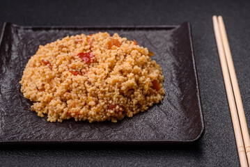 Delicious hot boiled wheat porridge couscous with vegetables