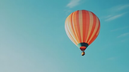 Naklejka premium Hot Air Balloon Soaring in the Blue Sky