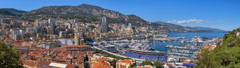 Obraz premium Port Hercules of Monaco - A panoramic overview of the city-state Monaco at Port Hercules, as seen from Prince's Palace, on a sunny Spring evening. Monaca, French Riviera, Europe.