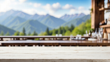 The empty white  wooden table top with blur background of restaurant in the mountains. For product display