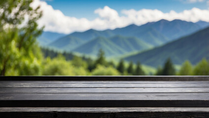 Fototapeta premium The empty black wooden table top with blur background of restaurant in the mountains. For product display