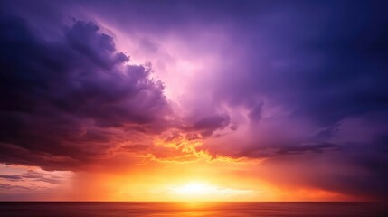 Fototapeta premium Stunning sunset scene with vibrant colors and dramatic clouds over the ocean, showcasing nature's beauty and tranquility.