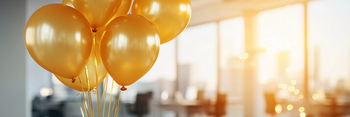 Golden balloons brightening a modern office space during a warm sunrise
