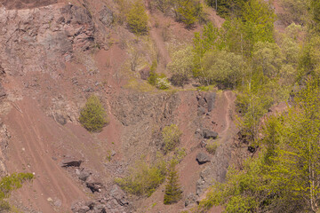Peaceful forest Kamyki lake after old quarry reflecting the vibrant green foliage under a clear blue sky, creating a serene and tranquil atmosphere © Pawel-Wierzchowski