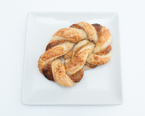 Pigtail bun on a white background