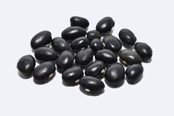 Small black beans on a white background.