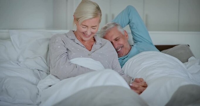 Relax, smile and senior couple in bed for romantic bonding, discussion and support in marriage. Care, old man and woman in bedroom for retirement morning, love and conversation for happy relationship