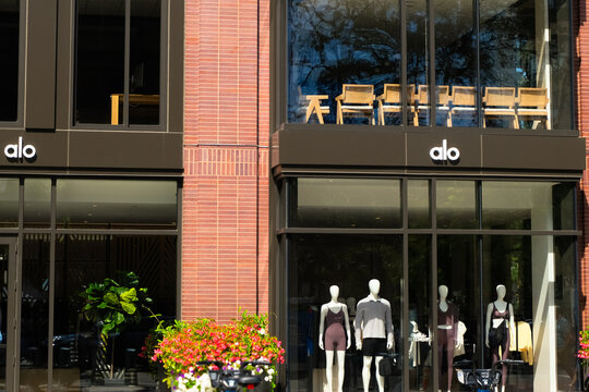 Boston, USA - 2 September 2024. General view of alo yoga logo sign and showcases on a store building facade