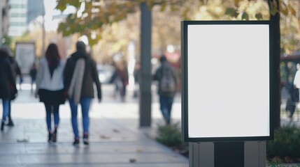 White blank billboard poster prominently displayed on a bustling urban street