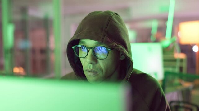 Business, hacking and man in information technology with computer for cyber crime, system or fraud. Office, data theft and hacker with network breach for unauthorised, server access or malware attack