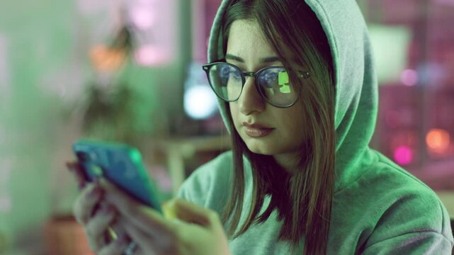 Office, hacking and woman in information technology with phone for cyber crime, update and fraud. Company, data hacker and theft with network breach for unauthorised, access and server malware report