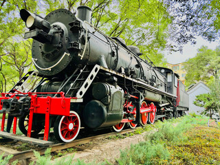 Vintage Coal Train Engine: Historical Steam Locomotive Standing Still