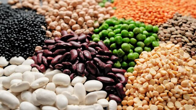 Various types of legumes, beans, lentils, chickpeas and peas. Legume set. Stock footage video 4k