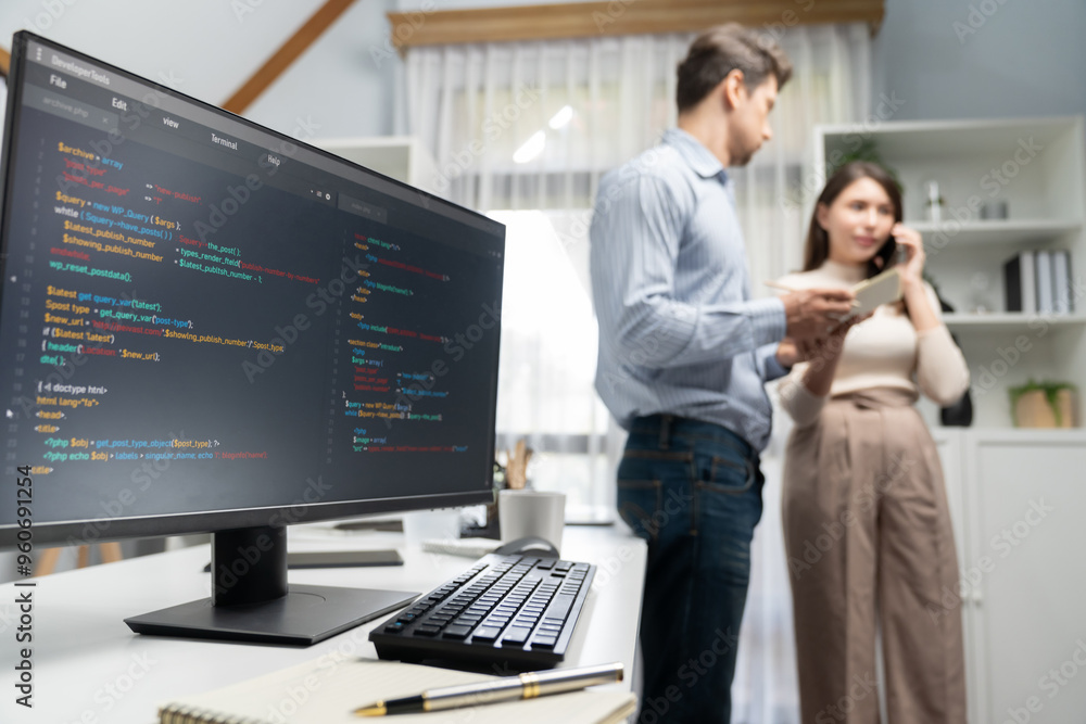 Poster coding software screens newest creative website on working desk against on woman developer making ph