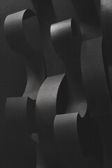 Wavy shapes made paper, dark background