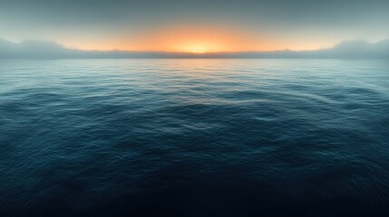 Fototapeta premium Gentle waves roll in as the sun rises, casting a serene ambiance over the tranquil ocean waters