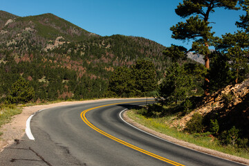 The mountain road curves towards Trail Ridge Road within Rocky Mountain National Park, Colorado.  