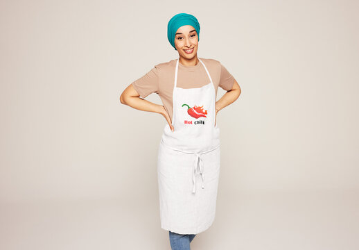 Woman wearing kitchen apron. PSD mockup