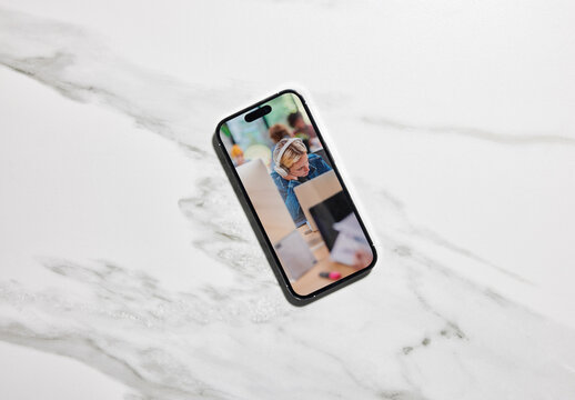 Mockup Of Black Smartphne On Marble Counterop. 