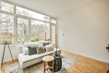Modern living room with natural light and stylish furnishings