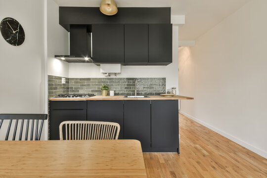 Modern kitchen interior with marble and wood accents - Powered by Adobe