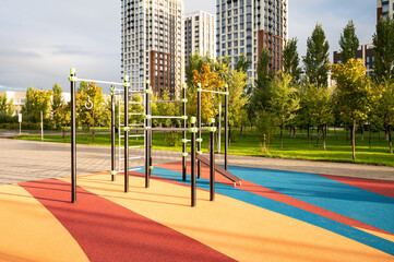 An empty sports ground with exercise equipment equipped for outdoor training in the park. Sports...
