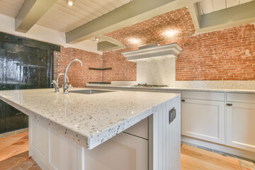 Modern kitchen with stylish brick wall elements