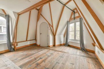 Charming attic room with exposed wooden beams