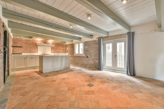 Renovated kitchen with brick walls and terracotta tiles