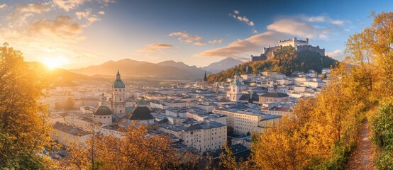 Naklejka premium This photograph shows the colorful nighttime cityscape of Salzburg including the famous Hohensalzburg Fortress, along with a wonderful autumn landscape with a picturesque sky line. Salzburger Land,