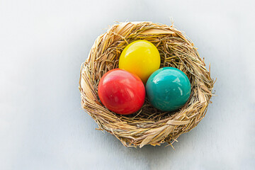 set of painted green and red eggs in basket design easter