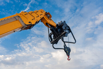 A lifting mechanism with a hook at the end of the boom of a heavy truck crane