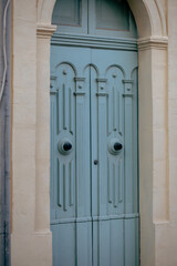 Blue closed door gate in an old furniture design in Malta Island